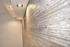 Aplicação de textura de parede em sala de estar, destacando acabamento sofisticado e moderno